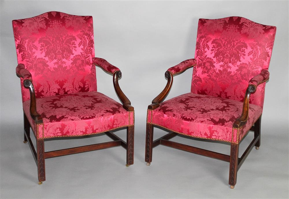 Appraisal: PAIR OF GEORGE III CARVED MAHOGANY OPEN ARM LIBRARY CHAIRS