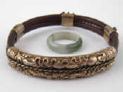 Appraisal: A vintage carved wood bangle with white metal tests silver