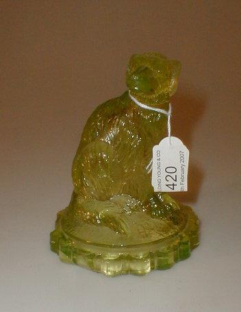 Appraisal: A Victorian pressed yellow glass model of a seated dog