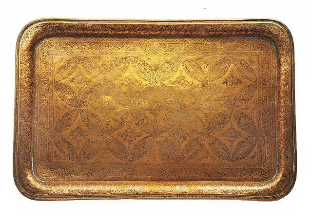 Appraisal: A Persian brass rectangular traywith allover arabesques figures and inscribed