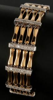 Appraisal: A TWO-TONE K GOLD BRACELET WITH DIAMONDS Eighty-four diamonds estimated