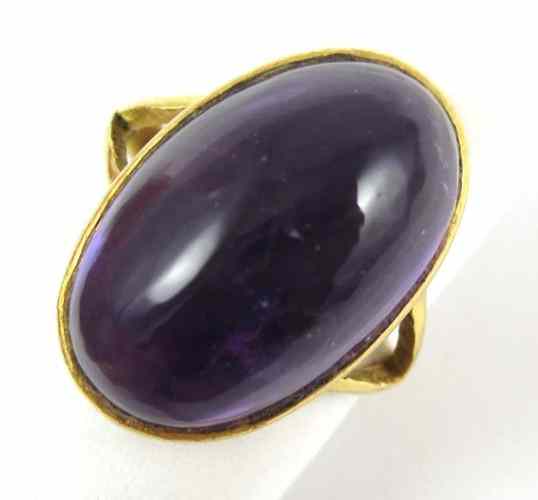 Appraisal: AMETHYST AND FOURTEEN KARAT GOLD RING set with a large