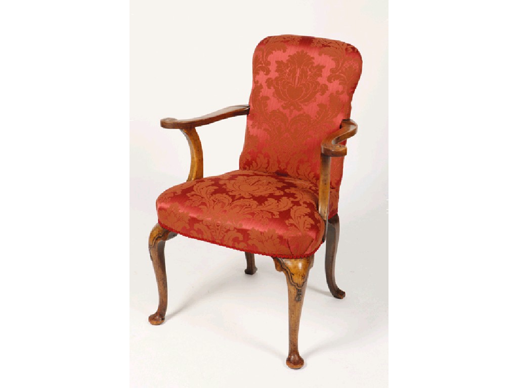 Appraisal: A GEORGE I STYLE UPHOLSTERED ARMCHAIR the shaped back and