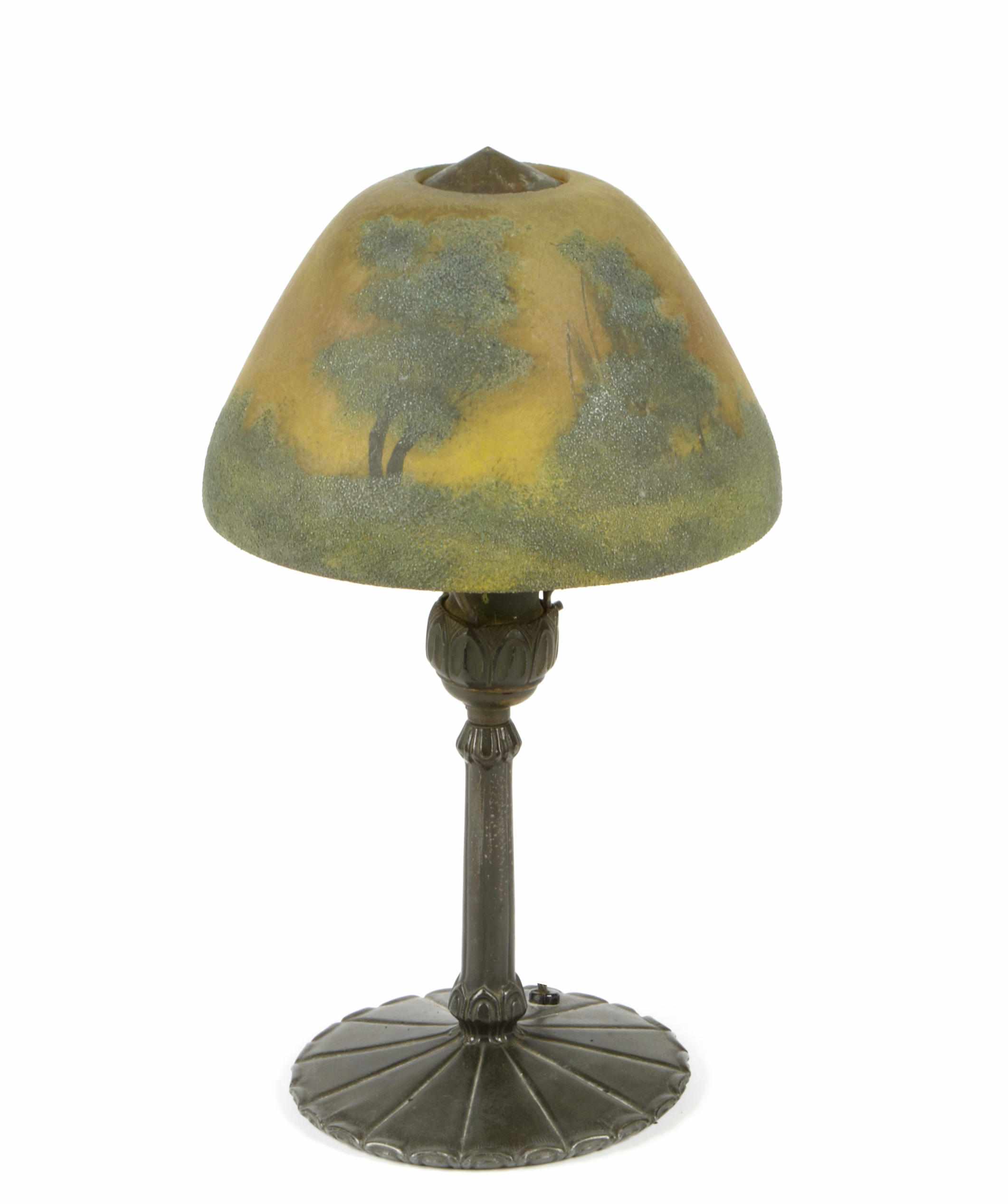 Appraisal: An American reverse painted glass and patinated metal landscape lamp