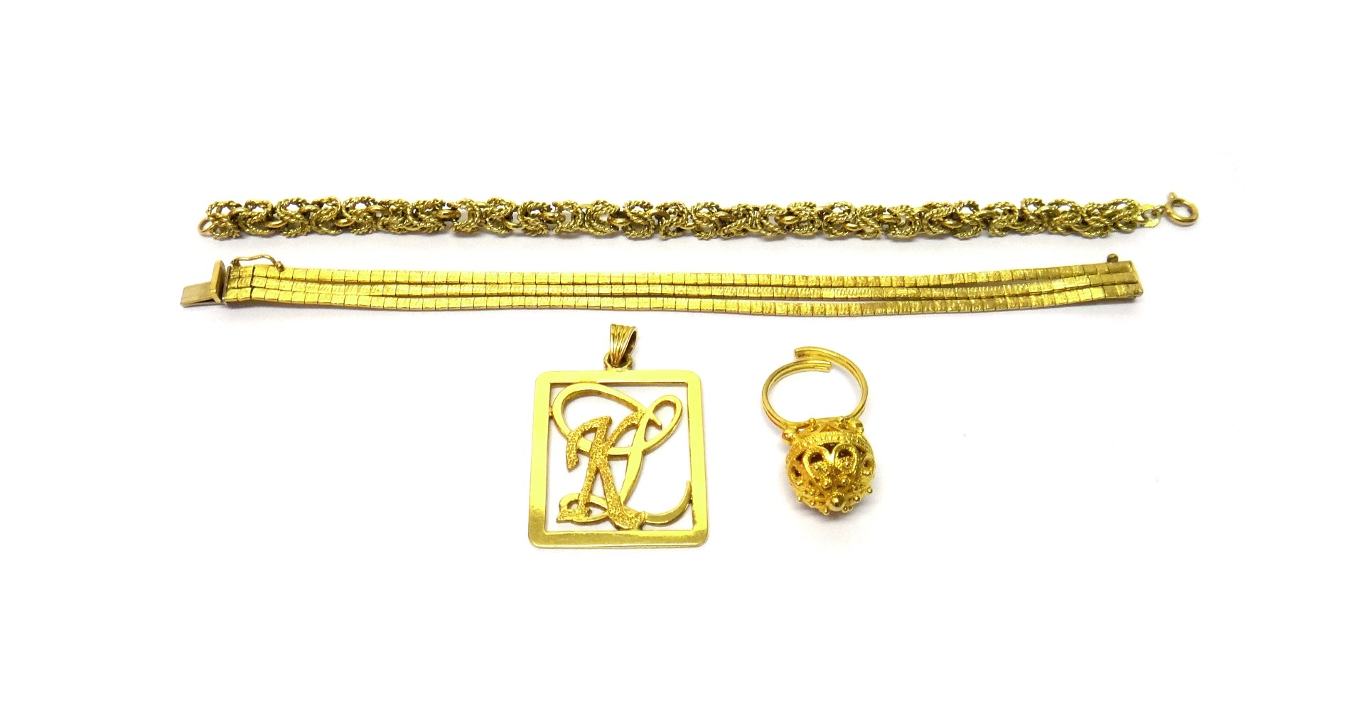 Appraisal: A gold bracelet in a three row design having a