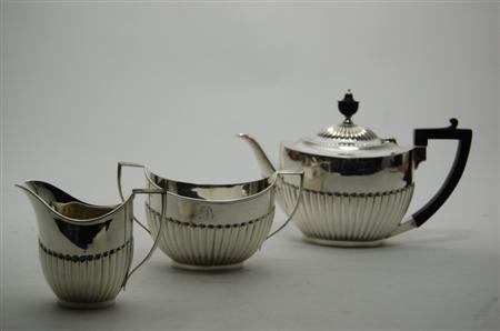 Appraisal: An Edwardian silver three piece tea set Sheffield comprising teapot