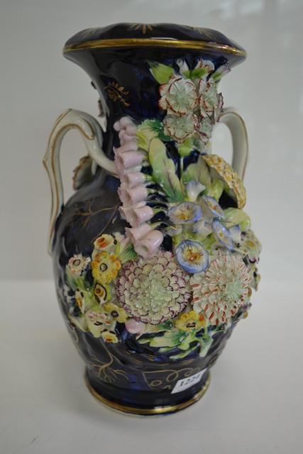 Appraisal: A PAIR OF TH FLORAL BOCAGE VASES PROBABLY COALPORT