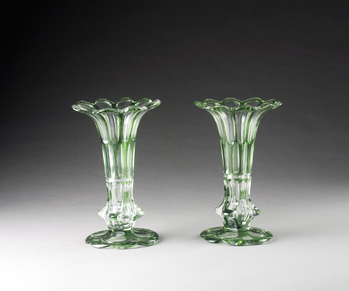 Appraisal: PAIR OF ENGLISH GREEN OVERLAY GLASS VASES WITH FLARED RIMS