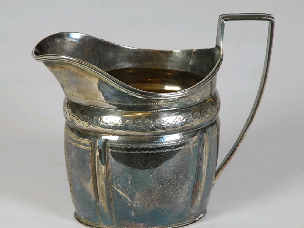 Appraisal: GEORGE IV ENGRAVED SILVER CREAM JUG oval with high angular