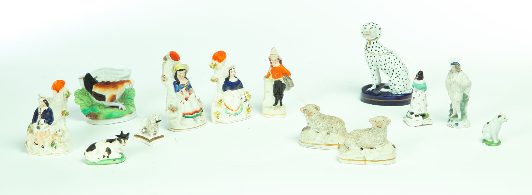 Appraisal: THIRTEEN STAFFORDSHIRE FIGURINES England nd half- th century Includes fireman