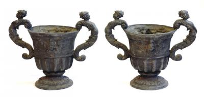 Appraisal: A PAIR OF LEAD GARDEN URNS of campana form with