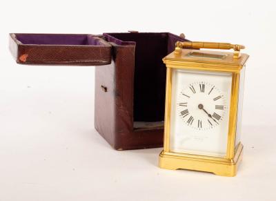 Appraisal: A gilt brass eight-day carriage clock the porcelain dial with