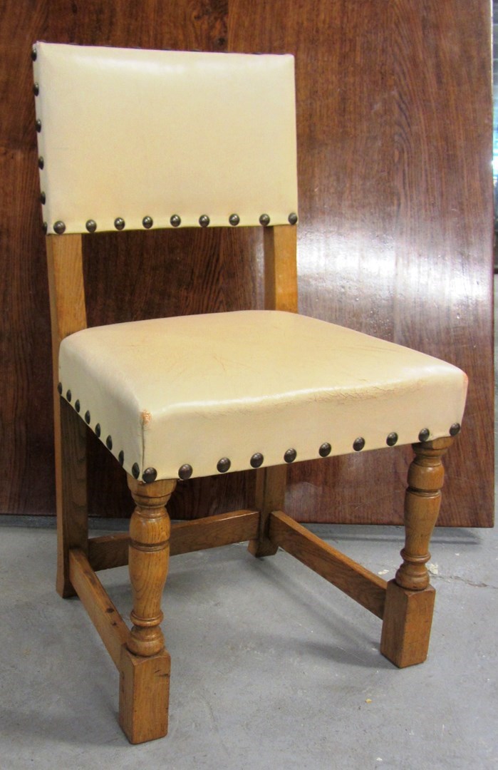 Appraisal: A set of ten th century cream leather upholstered oak