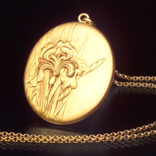 Appraisal: CARTER GOUGH Large Art Nouveau violet blossom locket on chain