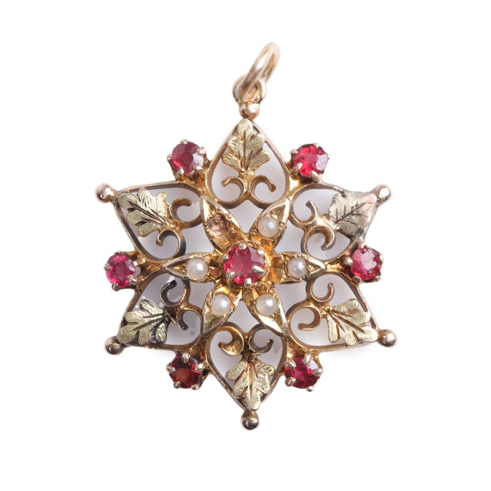 Appraisal: Yellow gold Victorian starburst snowflake pendant with seed pearls garnets