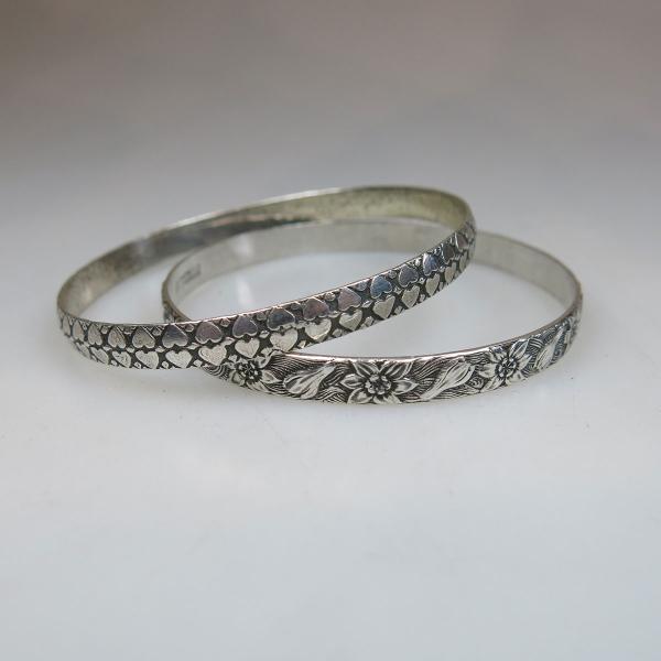 Appraisal: Danecraft Sterling Silver Circular Bangles with embossed decoration g weight