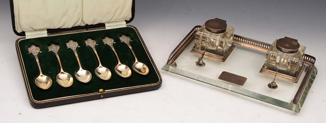 Appraisal: A GLASS AND SILVER MOUNTED DESK STAND with twin inkwells