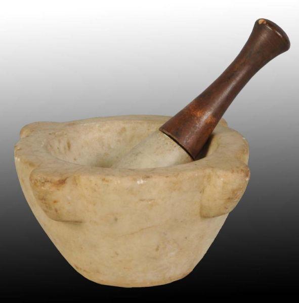 Appraisal: Stone and Wooden Mortar Pestle Description to A few chips