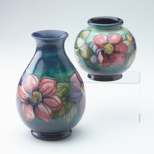 Appraisal: Two Moorcroft vases in the Anemone pattern largest with restoration