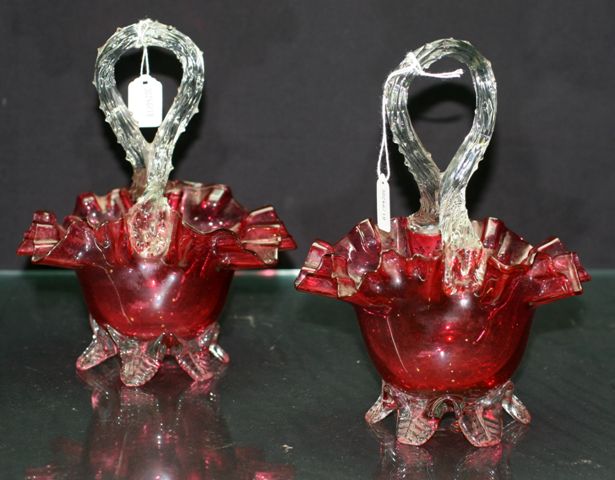 Appraisal: Pair of Victorian ruby glass footed sweets basket with looped