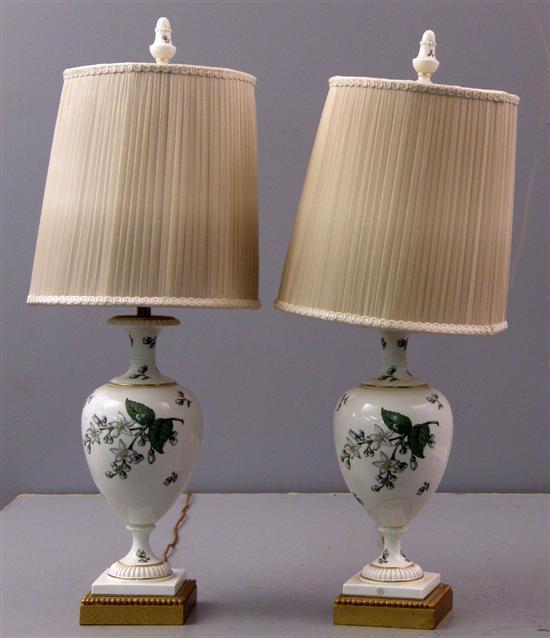 Appraisal: Pair of porcelain lamps decorated with white flowers on square