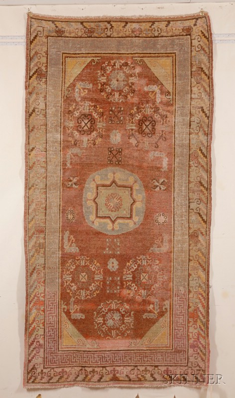 Appraisal: Khotan Rug East Turkestan th century repairs in field rewoven