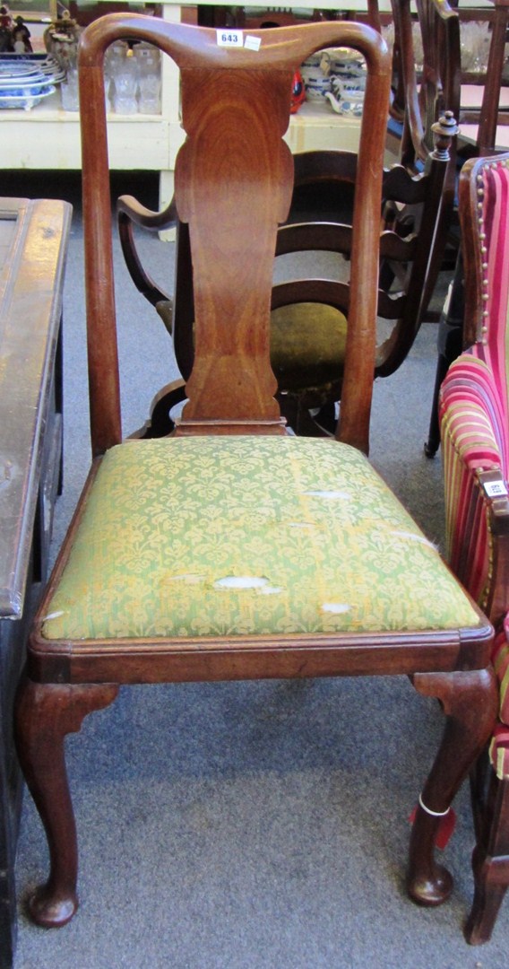 Appraisal: A pair of George I walnut vase back dining chairs