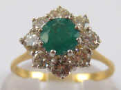 Appraisal: An carat gold emerald and diamond cluster ring the emerald