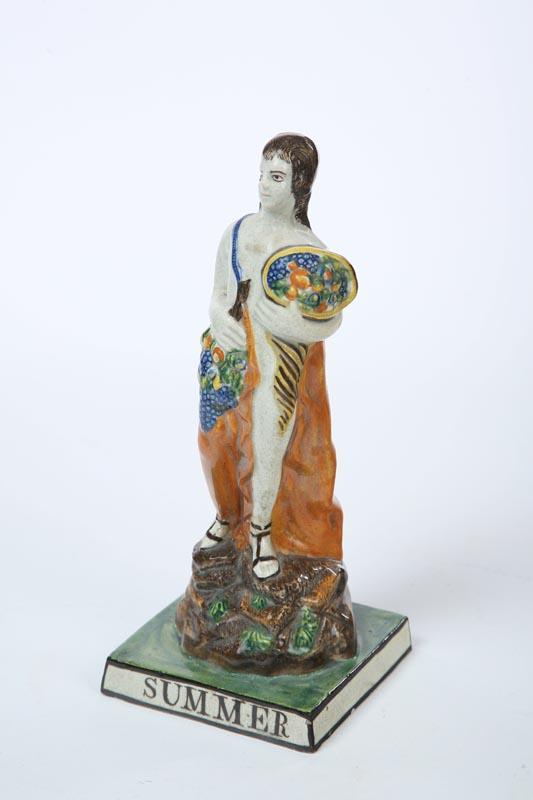 Appraisal: PEARLWARE FIGURE English early th century Prattware figure of Summer