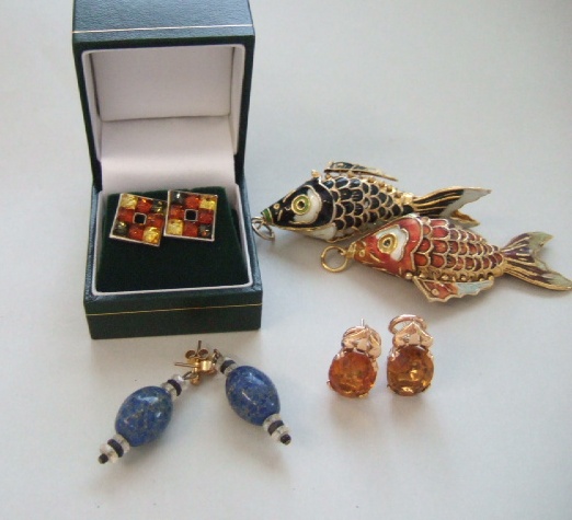 Appraisal: A pair of citrine set earclips each mounted with an