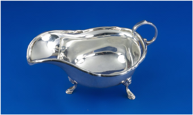 Appraisal: Silver Cream Jug Scroll handle on hooved feet Hallmarked Sheffield