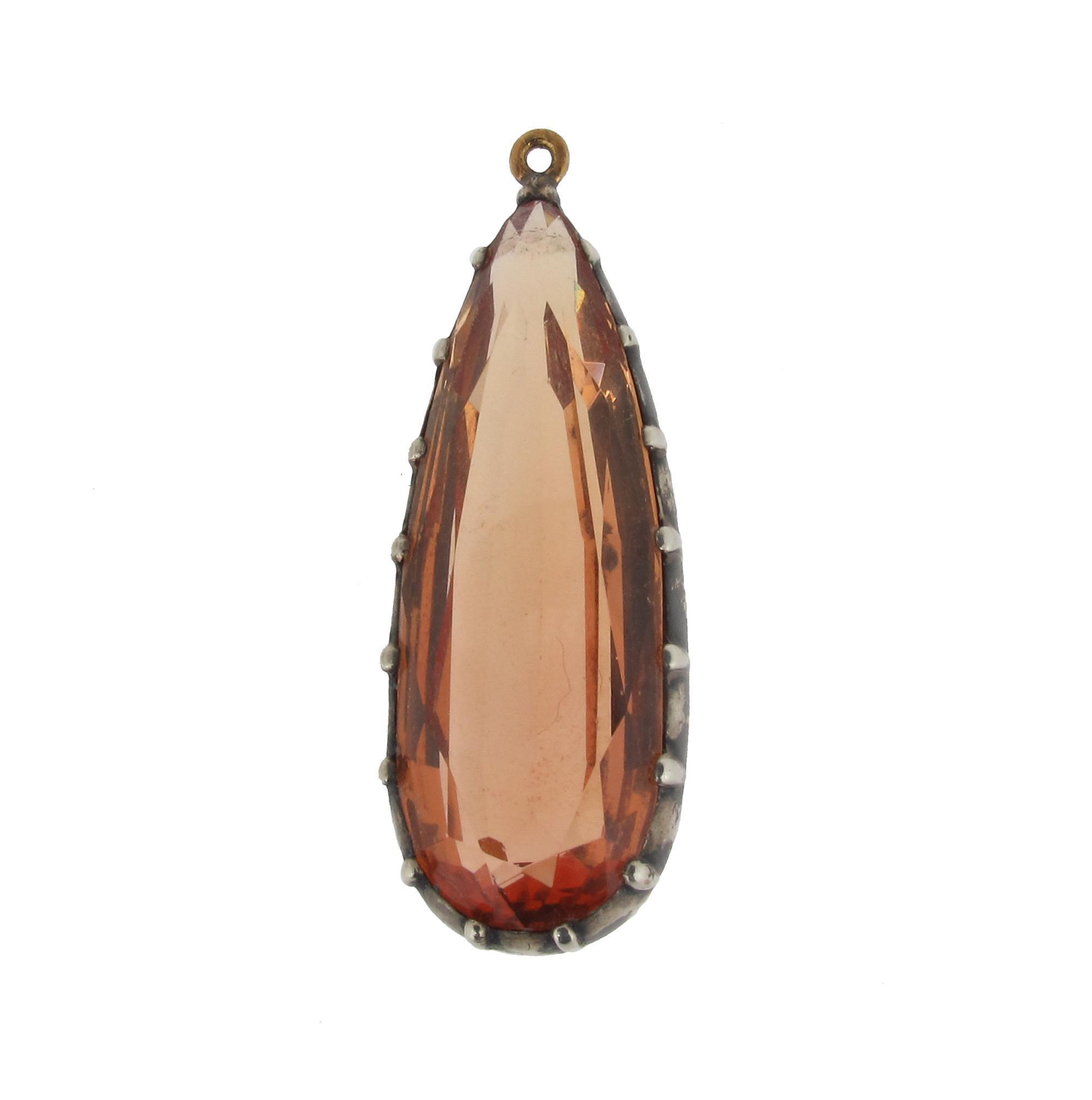 Appraisal: A pear shaped topaz pendant