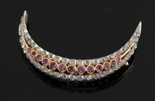 Appraisal: An Edwardian ruby and diamond crescent brooch Circa Comprising two