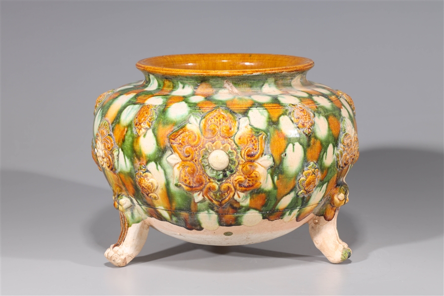 Appraisal: Chinese porcelain three-legged vase with sancai glaze and molded designs