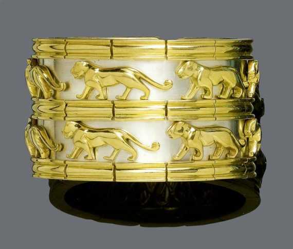 Appraisal: GOLD BANGLE Yellow and white gold g Very decorative double-row