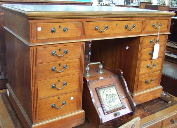 Appraisal: An Edwardian satinwood pedestal desk the gilt tooled blue leather