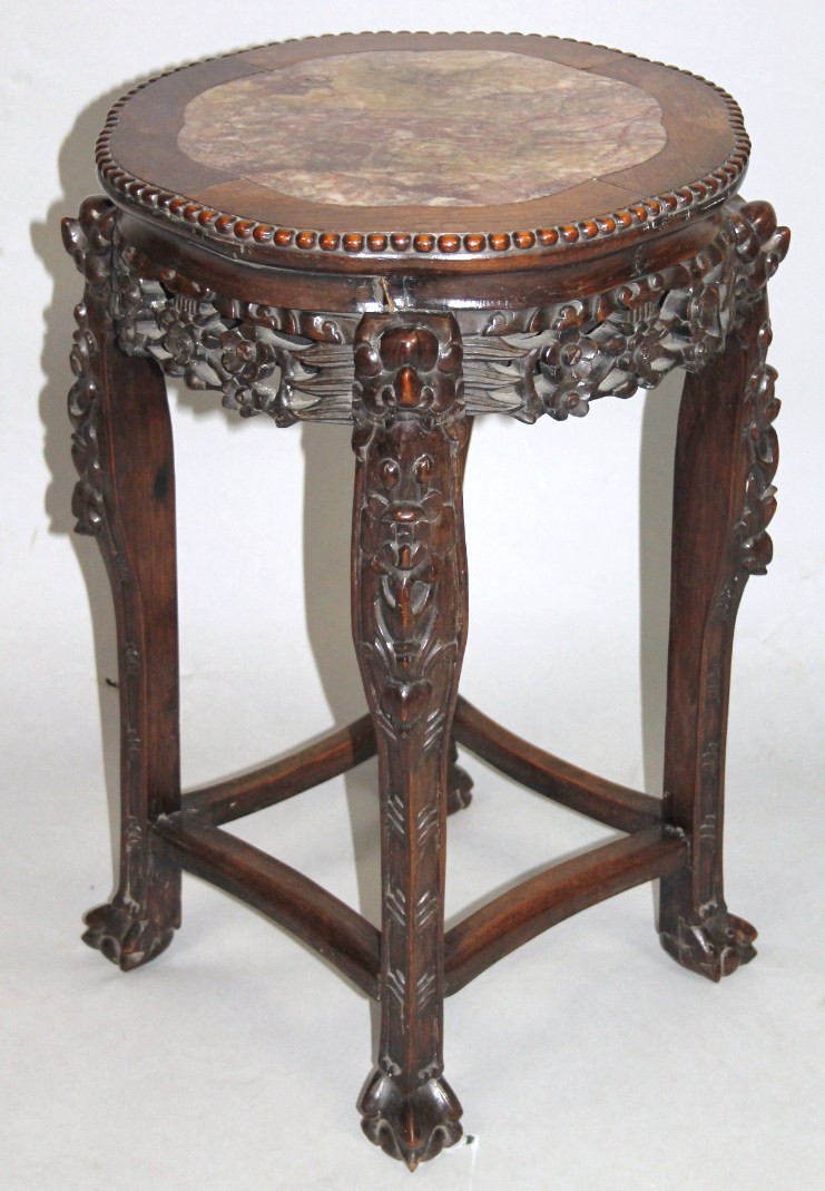 Appraisal: A Japanese Meiji period hardwood jardiniere stand the shaped circular