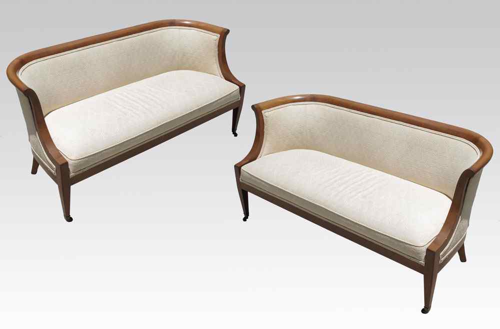 Appraisal: PAIR OF BIEDERMEIER STYLE SETTEES BY HERITAGE Shaped frame ivory