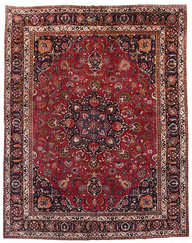 Appraisal: Mashad Carpet central blue medallion red field with floral sprays