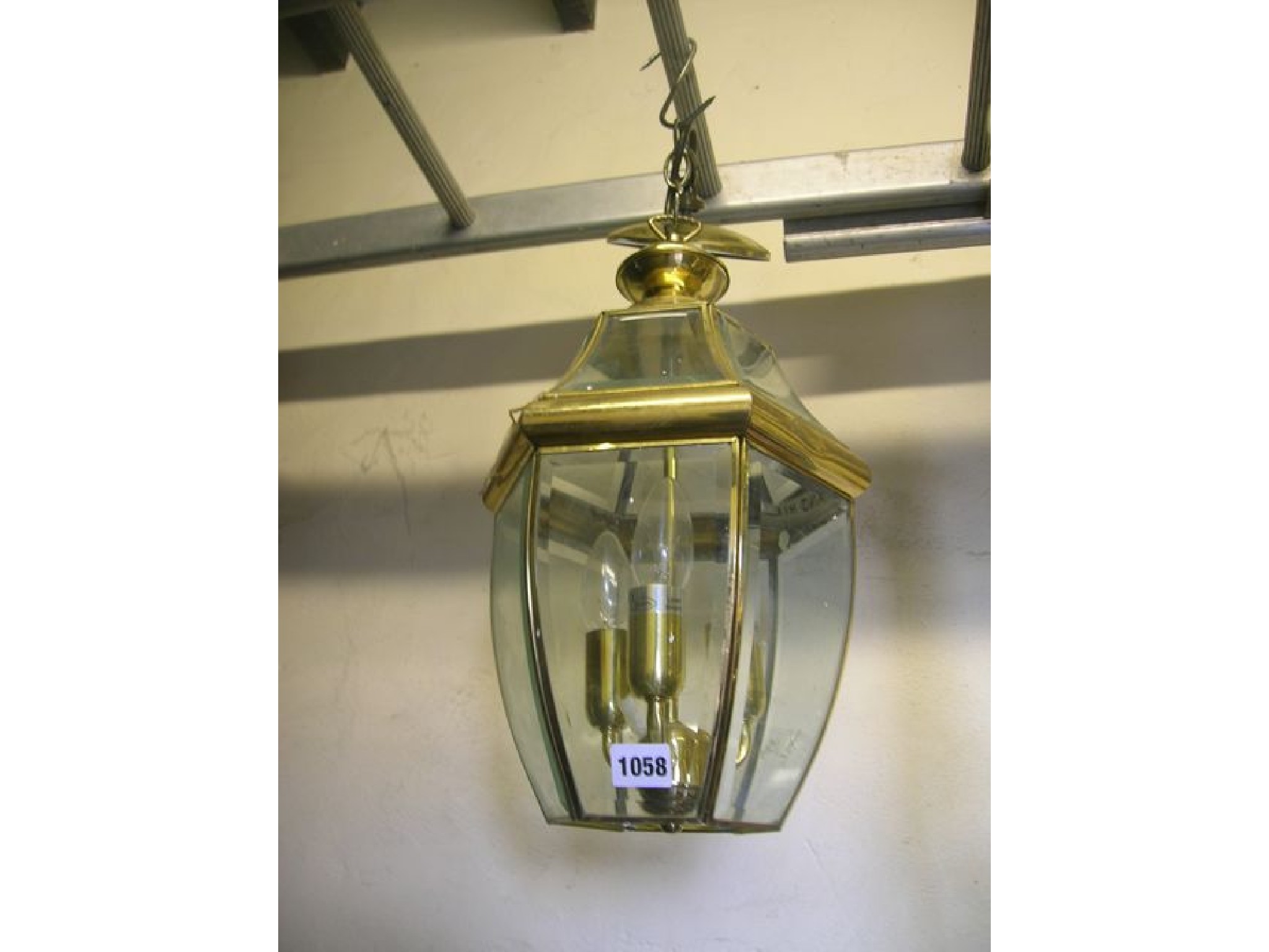 Appraisal: A contemporary hall lantern with three branch internal candle bulbs