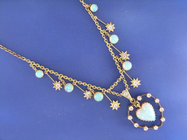 Appraisal: A vintage ct gold opal and diamond set pendant and