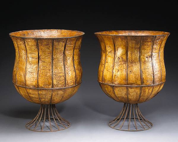 Appraisal: A pair of unusual iron mounted leather urns Each of