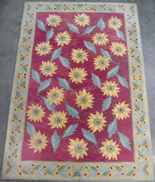 Appraisal: A Wool Tufted Area Rug sunflower pattern pastel colors '