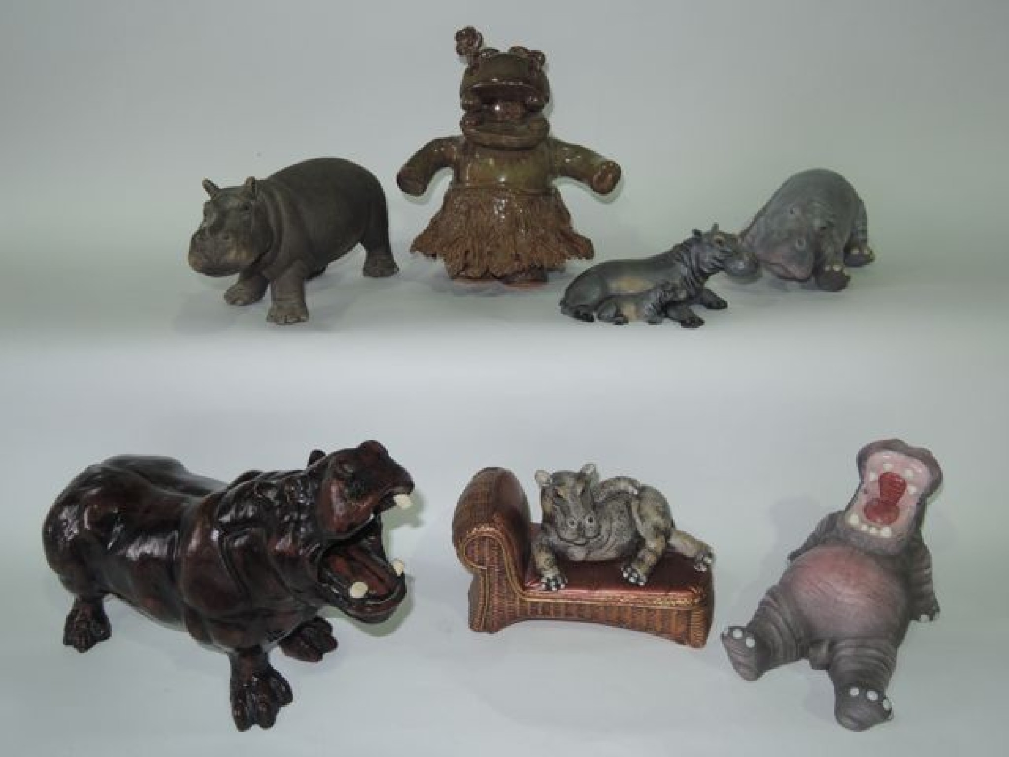 Appraisal: A collection of ceramic and other models of hippopotami including