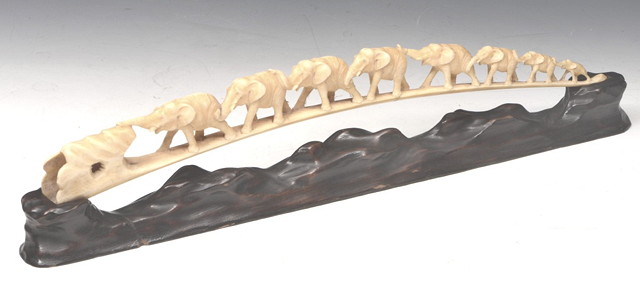 Appraisal: A JAPANESE CARVED IVORY ELEPHANT BRIDGE on original wooden stand