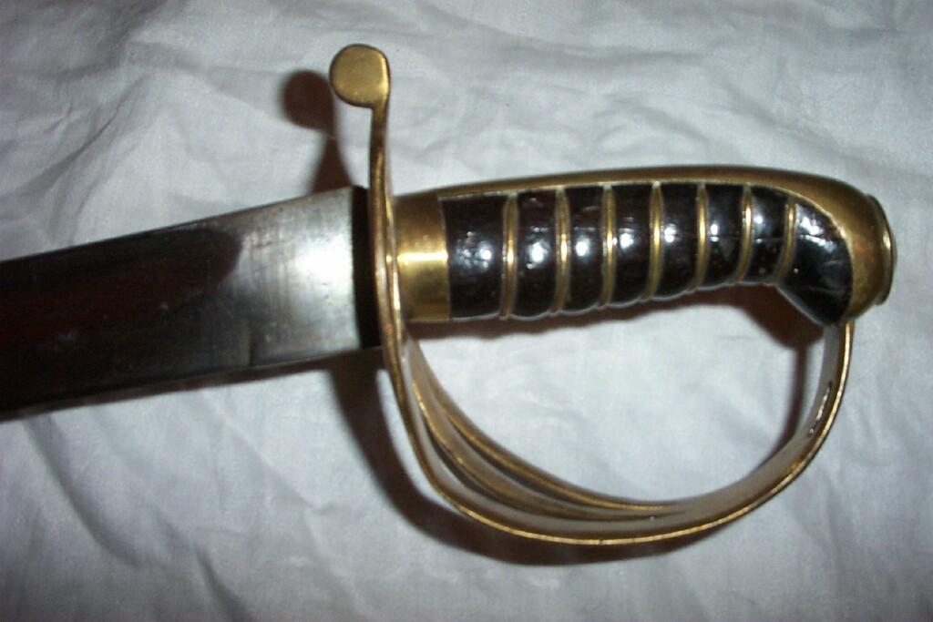 Appraisal: A late th century sabre with brass hilt and timber