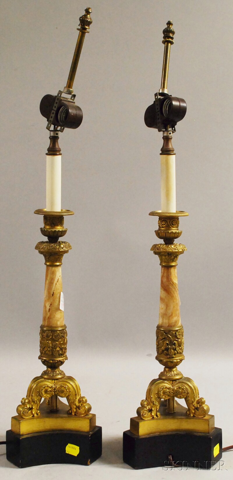 Appraisal: Pair of French Empire-style Gilt-bronze and Marble Columnar Candlestick Table