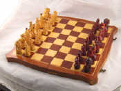 Appraisal: A hand carved wooden chess set possibly Austrian featuring figures