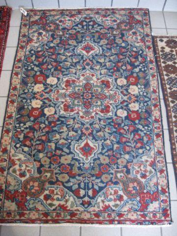 Appraisal: Persian Handmade Rug overall floral reds blues ivory ' x