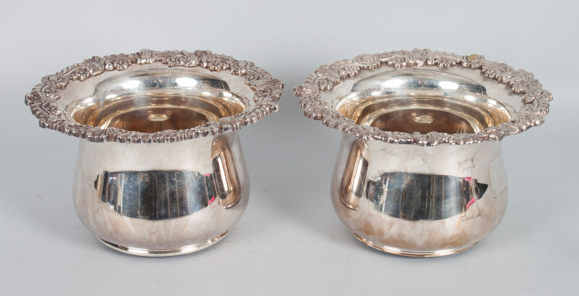 Appraisal: Pair of Sheffield silver-plate bottle coasters with unusually high walls